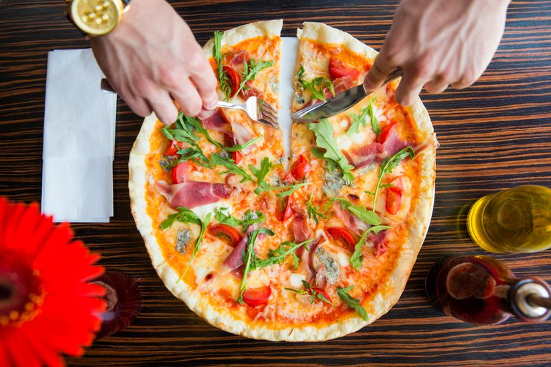 Prosciutto Arugula pizza with thin-sliced prosciutto and peppery arugula