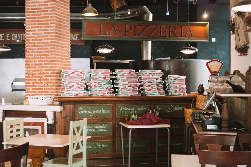 Jet's pizza kitchen team preparing fresh jet's pizza with quality ingredients