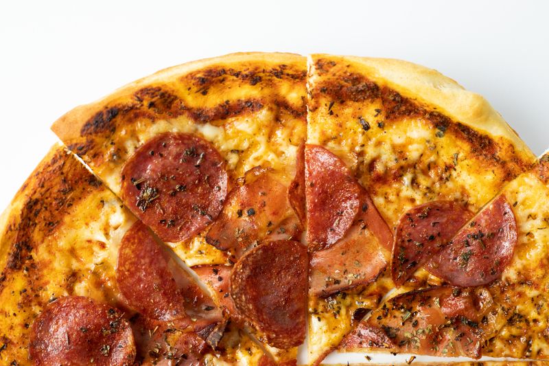 BBQ chicken jets pizza with caramelized onions